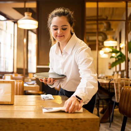 Person building skills in hospitality and independence
