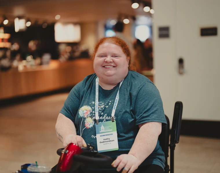 Girl in wheelchair supported by business and community partners